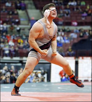 Genoa’s Jay Nino, a 220-pound junior, set a state season record for victories by beating Ben Sullivan.