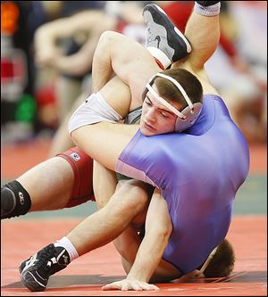 Central Catholic’s wrestler Alex Mossing, left, won 2-1 nail-biter win over Cuyahoga Falls CVCA's Jeff Hojnacki at 152 pounds in the semifinals.