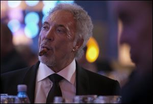 Welsh crooner Tom Jones smokes a cigar during a gala dinner marking the end of the 16th annual Cigar Festival in Havana, Cuba.