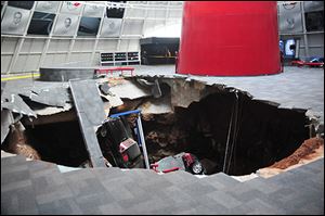 In this image provided by the National Corvette Museum shows several cars that collapsed into a sinkhole on Feb. 12 in Bowling Green, Ky.
