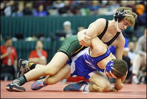 Richie Screptock, Clay’s first state champ, battles Nick Kiussis of Brunswick in the Division I 132-pound final. 