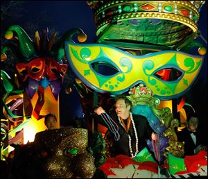 The Krewe of Orpheus rolls in uptown New Orleans, led by celebrity monarch Quentin Tarantino reigning over the superkrewe's 32-float parade on Lundi Gras, Monday.