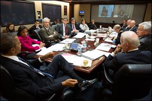 President Obama, left, convenes a National Security Council meeting in the Situation Room of the White House to discuss matters in Ukraine, on Monday in Washington. At right is Vice President Joe Biden.