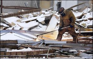 Demolition crews tear down the Woodville Mall  in Northwood.