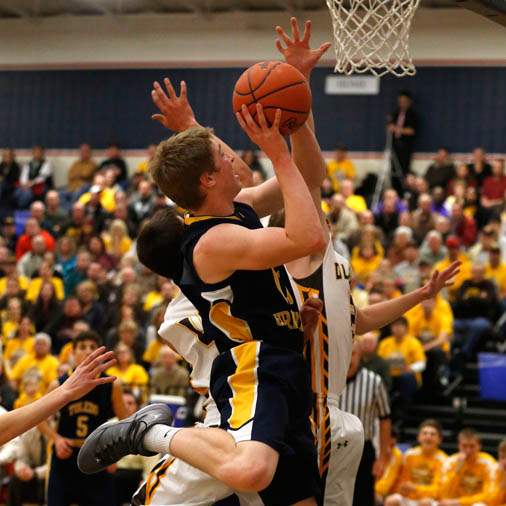 Toledo-Christian-s-Kyle-Kempton-is-fouled-by-Old-Fort-s