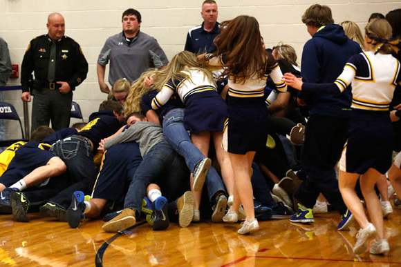 Toledo-Christian-fans-and-cheerleaders-pile-on-top-of-the-team