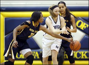 Notre Dame's Tierra Floyd (31) steals the ball from Rocky River Magnificat's Bridget Pryatel.