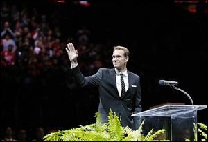 Former Detroit Red Wings defenseman Nicklas Lidstrom waves to the crowd during a pregame ceremony on Thursday in Detroit.