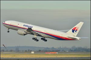 This photo provided by Laurent Errera taken Dec. 26, 2011, shows the Malaysia Airlines Boeing 777-200ER that disappeared from air traffic control screens Saturday, taking off from Roissy-Charles de Gaulle Airport in France.