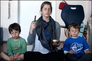 Kindergarten teacher Erica Eihl gets her students to use their senses while doing a meditation exercise at Citizens of the World Mar Vista in Culver City, Calif.