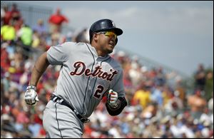 Detroit Tigers' Miguel Cabrera hits a two-run home run in the third inning of an exhibition spring training baseball game Monday in Jupiter, Fla.