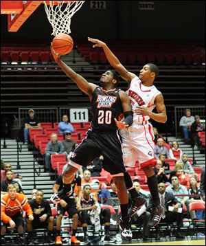 Bowling Green's Jehvon Clarke goes strong to the hoop during the team's 54-51 overtime loss to NIU in DeKalb, Ill.