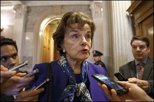 Senate Intelligence Committee Chair Sen. Dianne Feinstein, D-Calif. talks to reporters as she leaves the Senate chamber on Capitol Hill in Washington today.