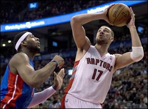 Toronto Raptors center Jonas Valanciunas (17) shoots against Detroit Pistons center Andre Drummond during first half.