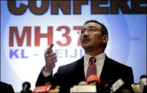 Malaysia's Minister of Transport Hishamuddin Hussein takes questions from the media during a news conference about the missing Malaysia Airlines jetliner MH370, today in Sepang, Malaysia.