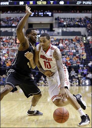 Ohio State’s LaQuinton Ross drives against Purdue’s Errick Peck in the second half. Ross had 19 points and 15 rebounds.