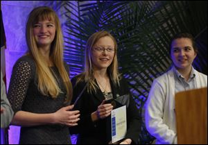 Madison Cook, left, and Ashlee Balcerzak, center, of Maumee High School, and Constance Baumgartner, right, were among winners of the Youth Jefferson Awards by Leadership Toledo during the  the annual Jefferson Awards breakfast Thursday.