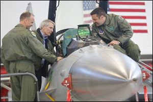 U.S. Sen. Rob Portman, center, speaks with pilots Lt. Col. Scott Schaupeter, left, and Maj. Greg Barasch as they look over an F-16 during Mr. Portman’s visit to the Ohio Air National Guard’s 180th Fighter Wing near Swanton. Later in the day, he attended the local GOP’s annual Lincoln Day Dinner.