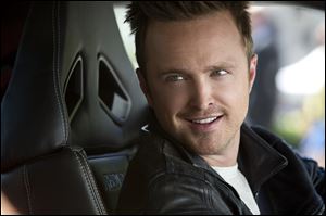 This image released by DreamWorks II shows Aaron Paul in a scene from the film, 'Need for Speed.'