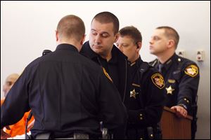 Omar Abou-Arab is taken into custody after his arraignment in Lucas County Common Pleas Court on charges of selling synthetic marijuana. He was later released on his own recognizance.