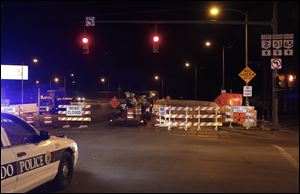 Workers set up barricades to the Anthony Wayne Bridge as repairs to the bridge are set to begin.    It is the fourth major upgrade in 50 years for the bridge, which also is known as the High Level Bridge.