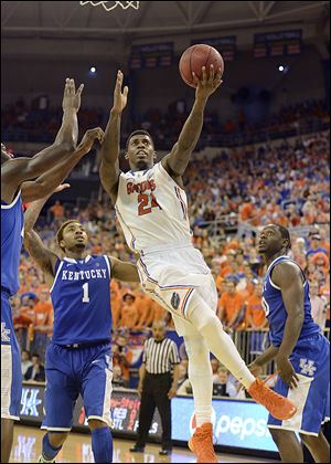 Senior Florida forward Casey Prather, slicing through the Kentucky defense, and the Gators are the overall No. 1 seed. Their march through the South could include a date with Ohio State.