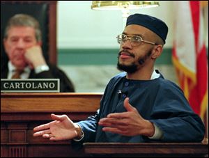 Siddique Abdullah Hasan, formerly known as Carlos Sanders, testifies before Judge Fred J. Cartolano in Cincinnati, during his trial on aggravated murder, kidnapping, and assault charges. Allowing prison inmates convicted for their role in Ohio's deadly 1993 prison riot to conduct face-to-face media interviews could give them too much “notoriety and influence” among fellow prisoners and cause problems throughout the prison system, the state argues in a court filing. 