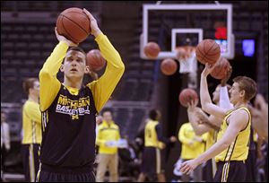 Michigan’s Nik Stauskas shoots during practice on Wednesday in Milwaukee. No. 2-seeded Michigan plays No. 15 Wofford today.