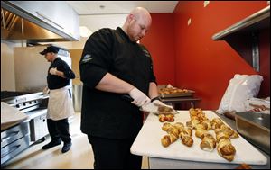 Chef Dusten Brown of the Mud Hens prepares Pretzel Super Twists for a food tasting event.