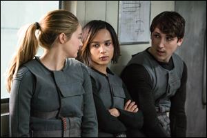 From left, Shailene Woodley as Beatrice ‘Tris’ Prior, Zoe Kravitz as Christina, and Ben Lloyd- Hughes as Will in the film, ‘Divergent.’