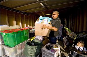 Carlos Jijon works to move things out of the garage of his house in Buena Park, Calif. Mr. Jijon and his wife had to navigate a market with tight inventory and investors armed with cash. 