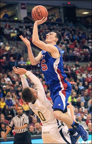 Crestview's Damian Helm, who scored 20 points, shoots over Louisville Aquinas' Pete Ruthe.