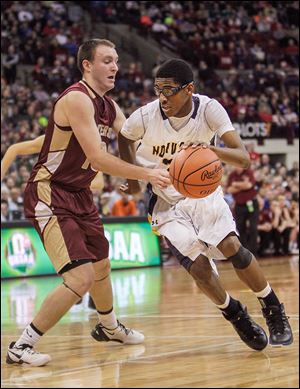 Norwalk's Ben Haraway, who had 29 points, drives against Columbus Watterson's Andy Greiser.