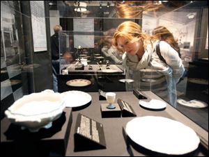 Elizabeth Magi of Toledo looks at some of artifacts on display at the Titanic Artifact Exhibition at Imagination Station.