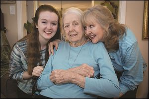 Brenna Hill, left, and Barrie Page Hill, right, live with Bobbie Wilburn, 79, who has Alzheimer's disease.