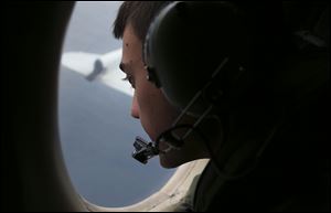 Sgt. Matthew Falanga on board a Royal Australian Air Force AP-3C Orion, search for the missing Malaysia Airlines flight MH370 in southern Indian Ocean today in Australia.