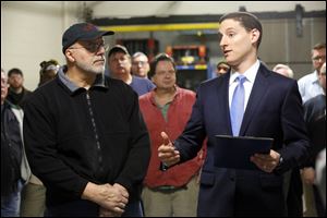 Ohio Treasurer Josh Mandel, right, presents John Incorvaia, an employee of Toledo Metal Spinning, with the first ‘Ohio Strong’ award. The new award will recognize local workers in manufacturing and the skilled trades, and encourage more people to pursue careers in these fields.