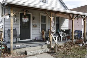 A German shepherd was shot in front of this home on Clark Street in Toledo.  The dog’s leg might have to be amputated.