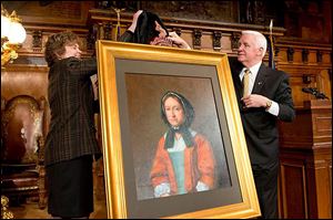 Gov. Tom Corbett and First Lady Susan Corbett unveil a portrait of Hannah Callowhill Penn on Sunday. It will be displayed among portraits of Pennsylvania’s founders and former governors, which include her husband, William Penn.