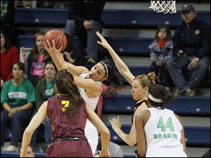 Notre Dame’s Natalie Achonwa pulls down an offensive rebound in front of Arizona State’s Joy Burke, left, teammate Ariel Braker, and ASU’s Eliza Norman, in the first half. Achomwa had 25 points.