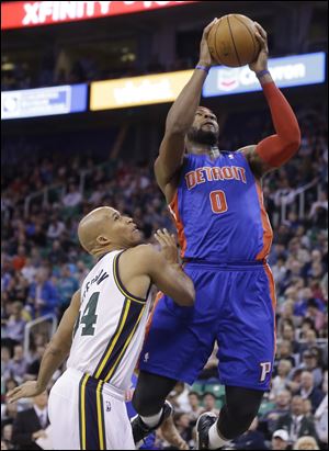 Detroit Pistons' Andre Drummond (0) goes to the basket as Utah Jazz's Richard Jefferson, left, looks on in the second quarter.