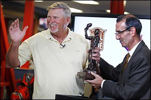 Larry Parrish is presented a trophy from International League president Randy Mobley for his induction into the league’s hall of fame. Parrish has a record of 569-552 as Toledo’s manager.