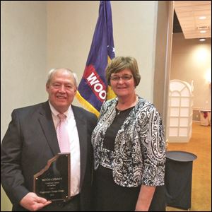 Jack Jones of Poggemeyer Design Groups stands next to Wood County Commissioner Doris Herringshaw at the Wood County Economic Development Commission’s awards dinner.