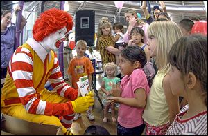 Ronald McDonald visits a McDonald’s in Roswell, N.M. Taco Bell is using real people named Ronald McDonald in a campaign to promote its new breakfast menu.