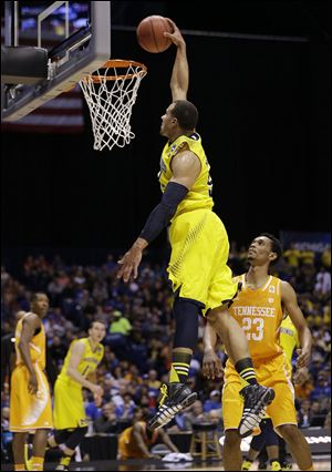 Michigan's Jordan Morgan goes up for a dunk during the first half against Tennessee on Friday. The Wolverines advance to the Elite Eight for the second season in a row.