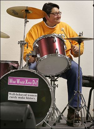 Toledoan Deb Dickerson plays drums for the band Someone’s Daughter, one of several female groups entertaining at WAVE.