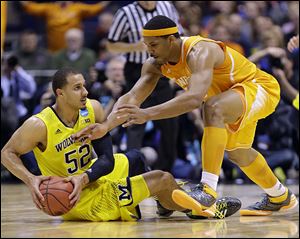 Michigan’s Jordan Morgan, left, has been a part of two Big Ten titles, two trips to the Elite Eight, and a national title game.
