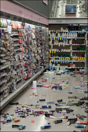 Merchandise is strewn across the floor in a La Habra Walgreens following a 5.1 earthquake centered near La Habra Friday night.