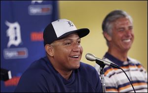 Detroit Tigers first baseman Miguel Cabrera shares a laugh with Tigers president, CEO, and general manager David Dombrowski during a news conference Friday.