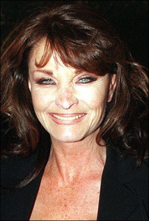 British actress Kate O'Mara poses for photographers in 1998.